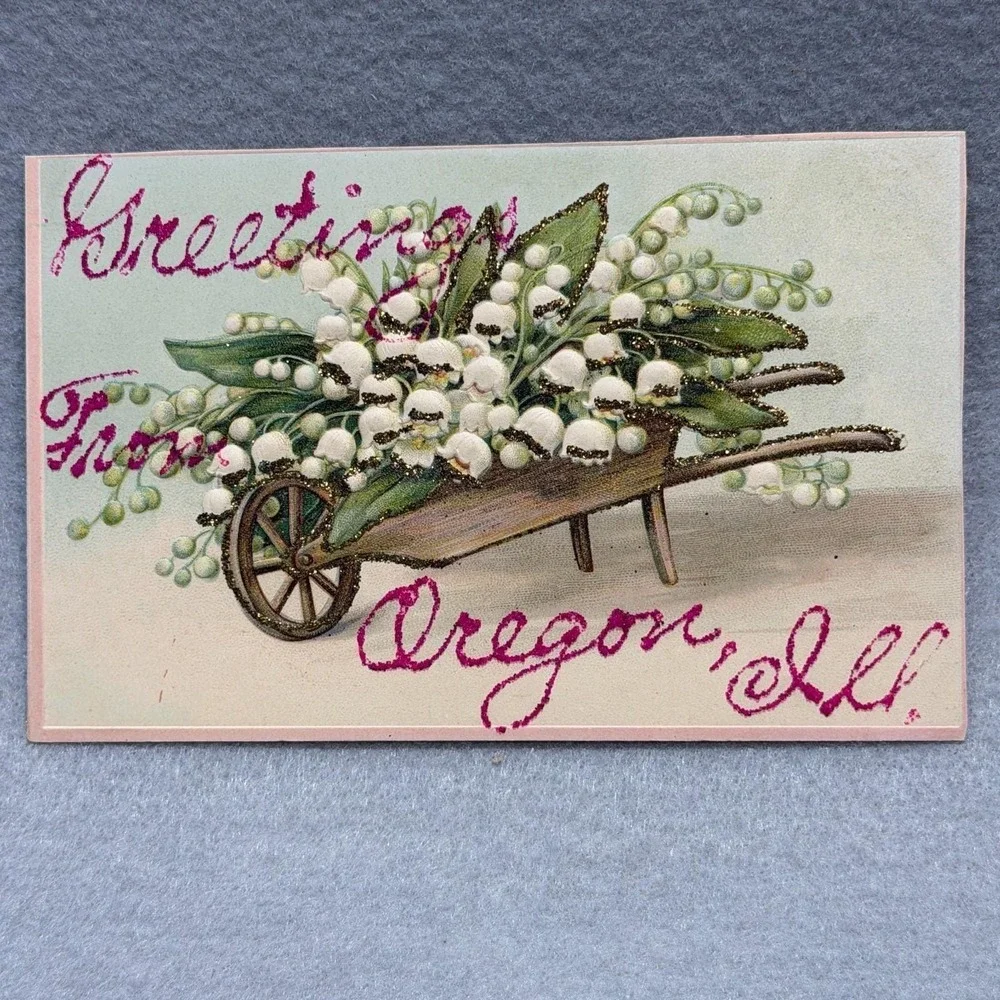 Greetings Oregon Illinois Lily of the Valley Wheelbarrow Embossed 1910s POSTCARD